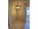 Cozy dining area featuring tile flooring and a stylish chandelier, perfect for intimate meals at 1050 Reading Ct, Winter Park, FL 32792