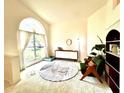 Cozy living area with a large window, stylish furniture, and a decorative rug, offering a comfortable space at 1672 Canoe Creek Rd, Oviedo, FL 32766