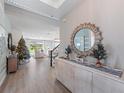 Inviting entryway featuring a decorative mirror and holiday decorations at 4413 Lions Gate Ave, Clermont, FL 34711