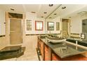Bathroom features granite countertops, double sinks, and a glass-enclosed shower at 637 15Th St, Debary, FL 32713
