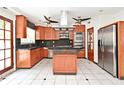 Spacious kitchen features wood cabinets, stainless steel appliances and a large island at 637 15Th St, Debary, FL 32713