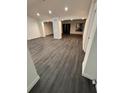 Bright and airy living room with recessed lighting and sleek hardwood flooring at 6849 Palomino Dr, Lakeland, FL 33811