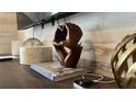 Wooden hand sculpture on shelf at 720 Las Fuentes Dr, Kissimmee, FL 34746