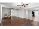 Open-concept living room with hardwood floors flowing to the kitchen at 818 Park Lake Cir # 10, Maitland, FL 32751