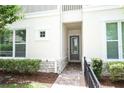 Inviting front entrance with brick pathway and stone accents at 922 Wild Date Ln, Lake Mary, FL 32746