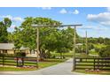 Charming property entrance with 'Morning Star Stables' gate and mature trees at 12434 Sullivan Rd, Clermont, FL 34715