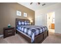 Comfortable bedroom with a queen-sized bed, soft carpet, and convenient ensuite bathroom access at 1439 Moon Valley Dr, Davenport, FL 33896