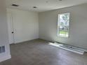 Well-lit bedroom with tile flooring and a large window at 15095 Grove Lake Dr, Winter Garden, FL 34787