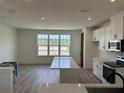 Bright kitchen featuring an island and modern appliances at 15095 Grove Lake Dr, Winter Garden, FL 34787