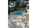 Inviting screened-in pool with surrounding patio, ideal for enjoying sunny days and warm evenings at 1586 Antoinette Ct, Oviedo, FL 32765