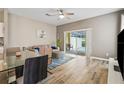Open living space with sliding glass doors leading to the pool, modern furnishings, and light wood floors at 17516 Blessing Dr, Clermont, FL 34714