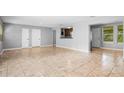 Spacious living room features neutral paint, large tile flooring, and lots of natural light at 1961 Winter Park Rd, Winter Park, FL 32789