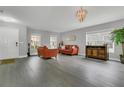 Spacious living room with wood floors, stylish furniture, and an elegant chandelier at 2657 Bullion Loop, Sanford, FL 32771