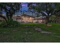 Lush backyard featuring a screened enclosure with a pool and ample space for outdoor activities and relaxation at 3461 Michigan St, Lake Mary, FL 32746