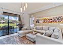Inviting living area with outdoor views, perfect for relaxing and entertaining at 7461 Bleecker Ln, Kissimmee, FL 34747