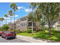 Condo with palm trees and well-kept landscaping at 8168 Boat Hook Loop # 201/718, Windermere, FL 34786