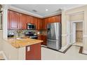 Well-equipped kitchen featuring stainless steel appliances, granite countertops, and ample cabinet space at 934 Rock Harbor Ave, Orlando, FL 32828