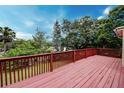 Spacious outdoor deck, perfect for entertaining or relaxing, with scenic views of the surrounding greenery at 1335 E 3Rd Ave, Mount Dora, FL 32757
