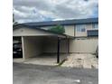 Attached carport with parking and an adjacent fenced area offering outdoor privacy at 1815 Townhall Ln # 1815, Orlando, FL 32807