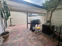 Large outdoor patio with grill and shaded area at 1815 Townhall Ln # 1815, Orlando, FL 32807