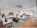 Bright and airy living room seamlessly connects to the kitchen for modern, open-concept living at 2922 Reef Knot Pl, Winter Park, FL 32792