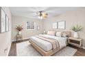 Stylishly decorated bedroom with a ceiling fan, neutral tones, and ample natural light at 4312 Lake Underhill Rd # 19-B, Orlando, FL 32803
