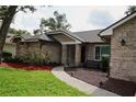 Charming single-Gathering home with brick exterior, mature trees, and a well-maintained lawn at 687 N Endeavour Dr, Winter Springs, FL 32708