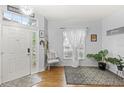 Bright entryway features stylish decor and lots of natural light at 8495 Lake Amhurst Trl, Orlando, FL 32829