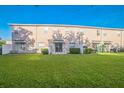 Relaxing backyard featuring a well-maintained lawn and a cozy patio area at 16449 Cedar Crest Dr, Orlando, FL 32828