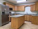 Spacious kitchen with stainless steel appliances, granite countertops, and a central island at 211 Valencia Rd, Debary, FL 32713