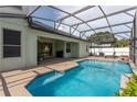 Relaxing screened-in pool area with clear blue water, perfect for enjoying outdoor living at 2406 Blossomwood Dr, Oviedo, FL 32765