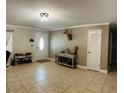 Inviting foyer with tile floors, a console table, and a charming deer head mount at 255 Belinda Dr, Deland, FL 32720