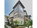 Stunning townhome showcasing architectural details, manicured landscaping, and a welcoming facade at 312 Trieste Loop, Lake Mary, FL 32746