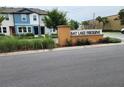 Welcome to Bay Lake Preserve: a well-maintained community with lush landscaping and inviting entrance at 3248 Merton Aly, Orlando, FL 32808