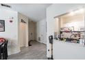 Open floor plan hallway that shows the entrance and kitchen at 4833 Cypress Woods Dr # 4205, Orlando, FL 32811
