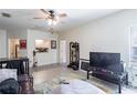 Spacious living room boasts a ceiling fan, wood-look flooring, and great lighting at 4833 Cypress Woods Dr # 4205, Orlando, FL 32811
