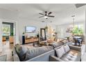 Cozy living room with modern decor, plush seating, and plenty of natural light for comfortable living at 489 Grape Ave, St Cloud, FL 34769