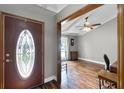 Inviting foyer featuring hardwood floors, an ornate front door and an open view into a living space at 526 Sabal Trail Cir, Longwood, FL 32779
