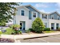 Charming two-story townhome with manicured lawn and inviting front entrance at 8900 Sydney Ave, Kissimmee, FL 34747