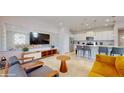 Open-concept living area with modern kitchen, stylish furniture, and sleek design at 8900 Sydney Ave, Kissimmee, FL 34747