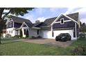 Beautiful home with a three-car garage and a well-manicured lawn at 1207 Ridge Lake Way, Oakland, FL 34787