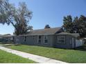 A cozy home with a well maintained lawn, a sturdy roof, and ample sunlight at 1600 Roosevelt Ave, Orlando, FL 32804