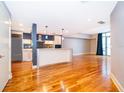 Modern kitchen with stainless steel appliances, island and wood floors at 260 S Osceola Ave # 710, Orlando, FL 32801