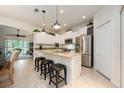 Open kitchen featuring granite countertops, stainless steel appliances, and pendant lighting at 411 Evening Sky Dr, Oviedo, FL 32765