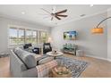 Comfortable living room with large windows, plantation shutters, and cozy seating arrangement at 4221 Isle Vista Ave, Belle Isle, FL 32812