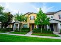 Townhome featuring well maintained lawn and tidy landscaping at 5029 Walker St, St Cloud, FL 34771