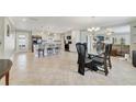 Open-concept kitchen with a large island, stainless steel appliances, and ample counter space at 5984 Ed Harris Ct, St Cloud, FL 34771