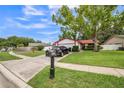 Nice one story home with a well manicured lawn and attractive landscaping at 8040 Sagebrush Pl, Orlando, FL 32822