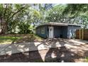 This cozy home has a welcoming front yard, a covered entryway, and a well-maintained lawn at 845 Edgewater Cir, Eustis, FL 32726