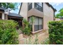 Beautiful exterior view with a gated entrance, lush landscaping, and a two-story design at 940 Douglas Ave # 132, Altamonte Springs, FL 32714